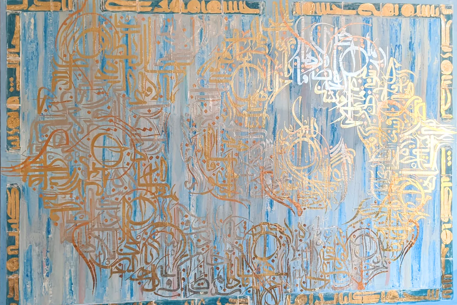 Phoenix: a wide blue panel worked over with gold calligraphic forms and a bordered frieze